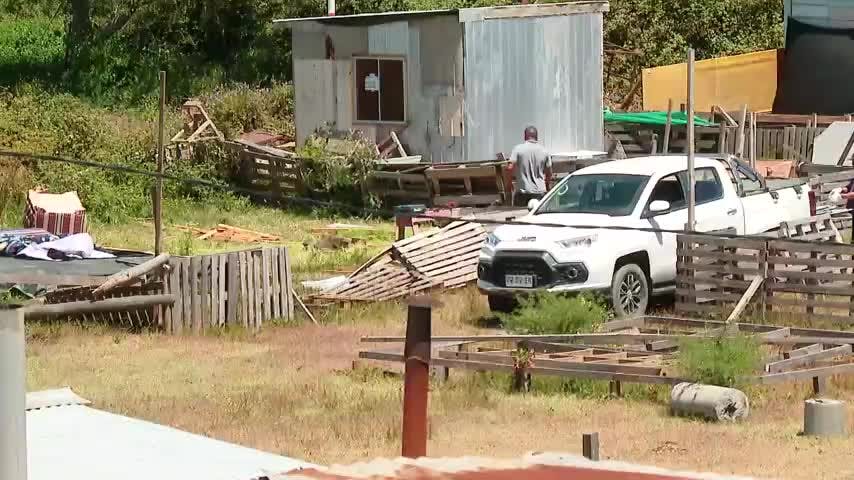Formalizan a veintena de pobladores por toma de terreno