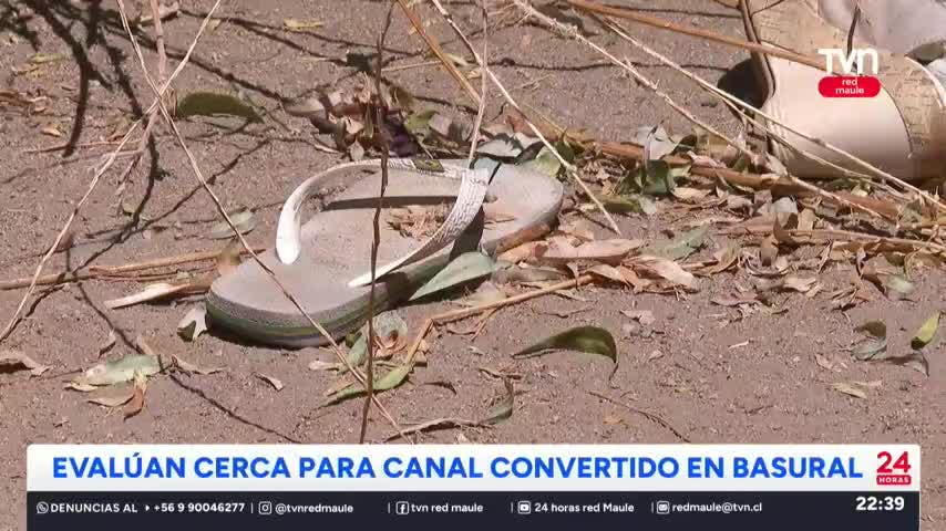 Evalúan cerca para canal convertido en basural